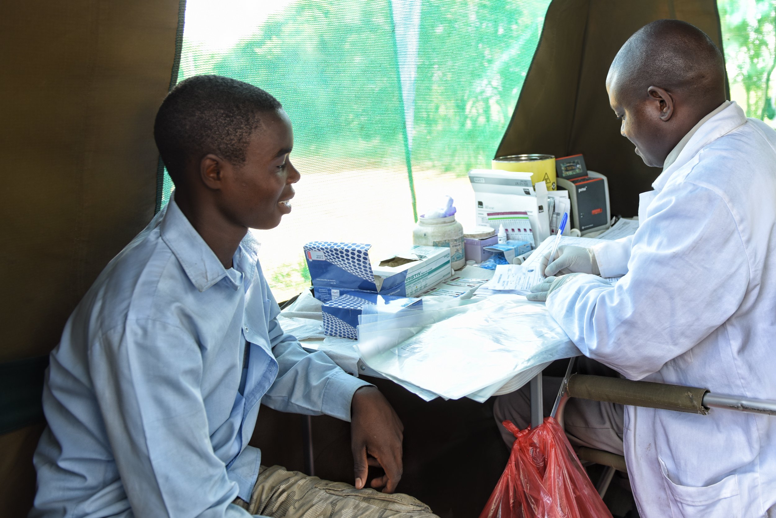 Health worker providing HIV testing services in Godzi, Zimbabwe