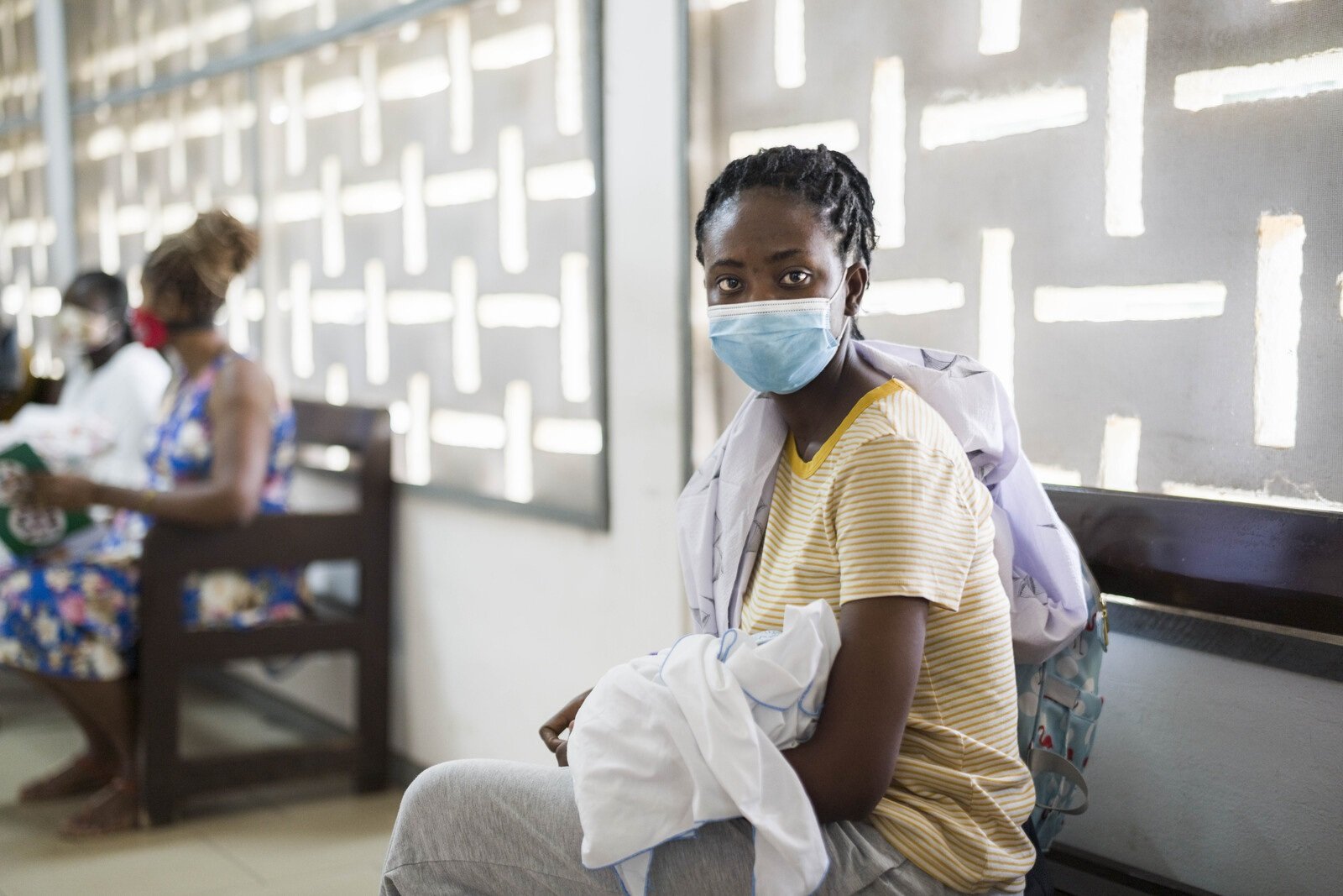 Woman holding baby in waiting room